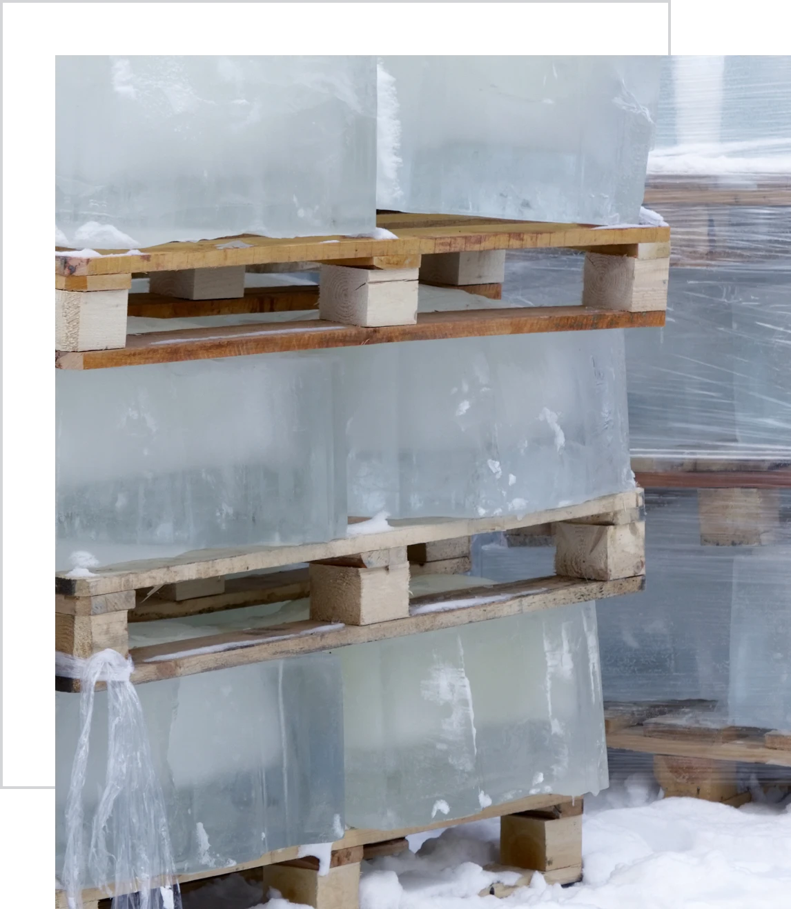 Stacked ice blocks on wooden pallets